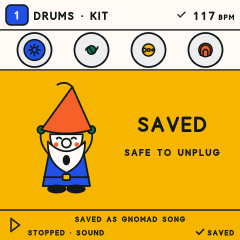 The FM-1 screen after saving: the Gnome cheers beside the words Saved, safe to unplug.